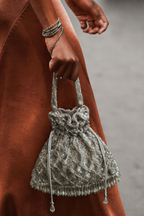 Luxury silver wedding guest purse featuring statement tassels and artisanal embellishments