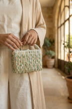 Luxury vacation evening purse featuring intricate beadwork and statement texture