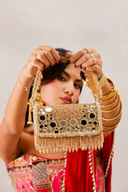 Luxury wedding guest purse featuring reflective mirror embellishments and handcrafted texture