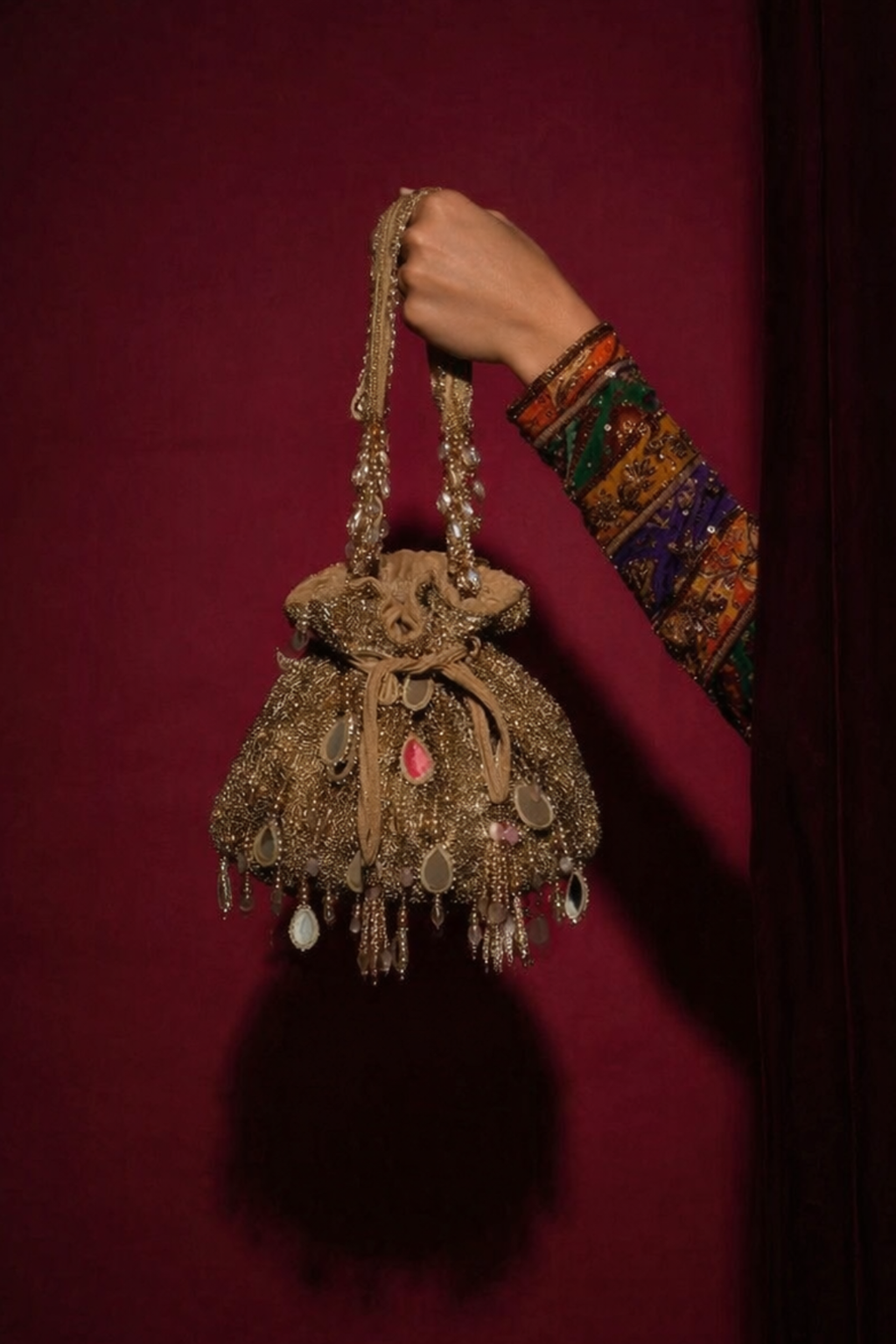 Luxury wedding guest purse featuring mirror accents and elegant tassel embellishments