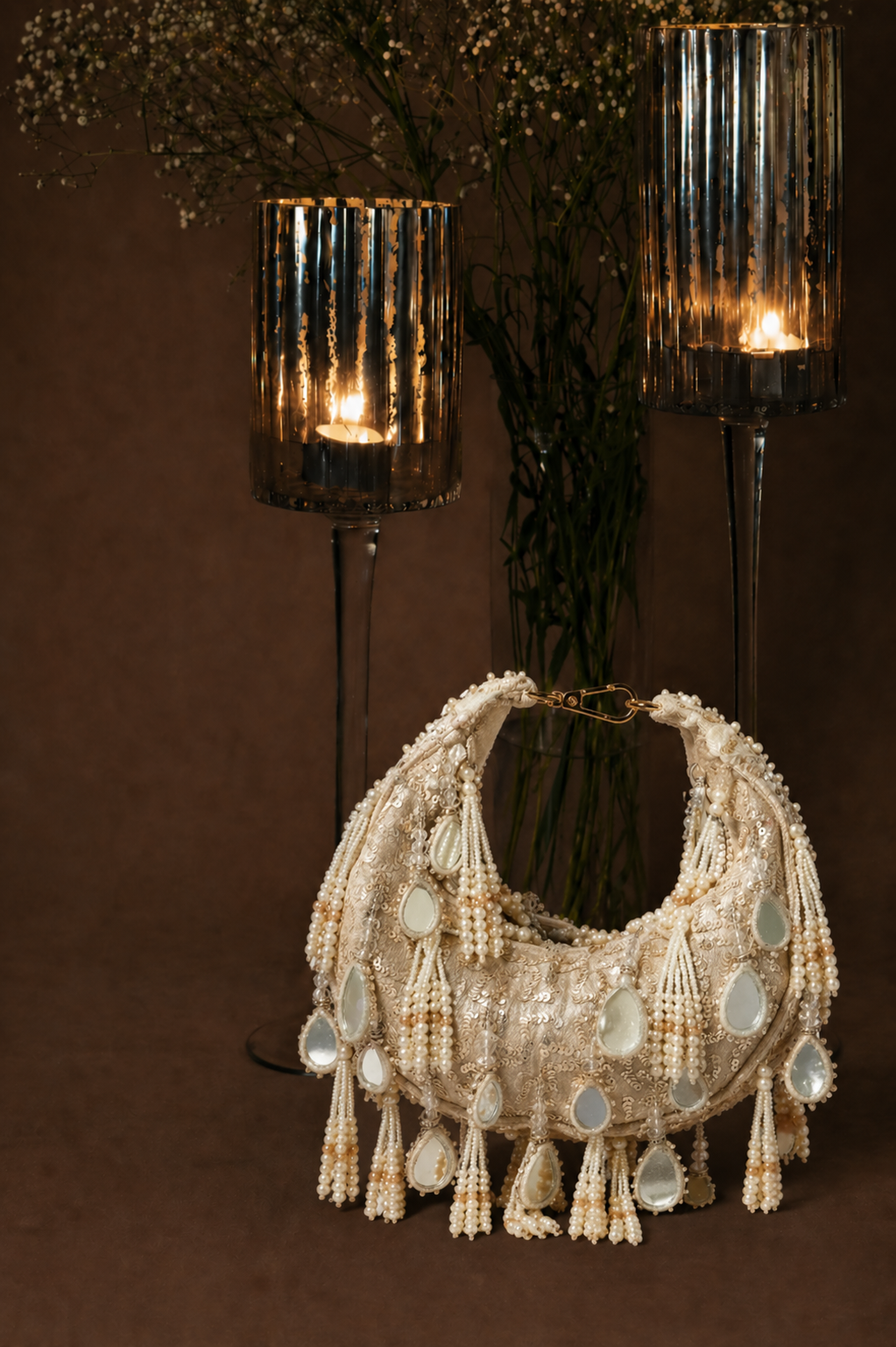 Pearl tassel occasion handbag featuring reflective mirror accents and artisanal craftsmanship