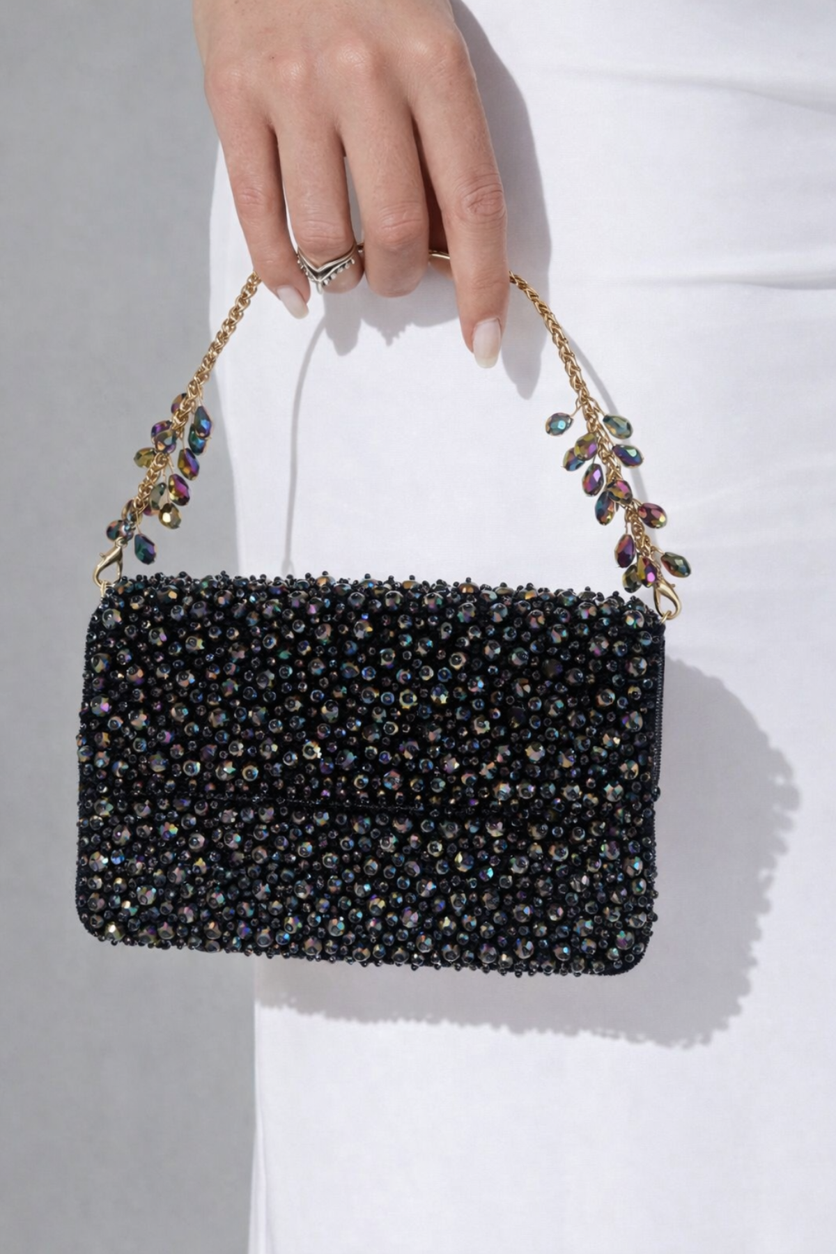 Multicolor embellished statement bag featuring handcrafted crystal detailing and luxe texture