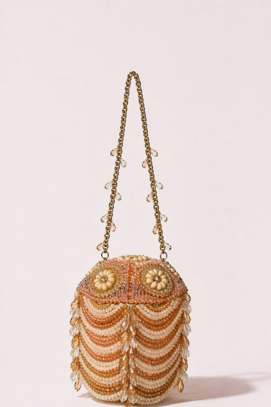 Luxury peach pearl embellished evening bag with crystal detailing and statement handle