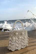 Pearl beach vacation bag with layered pearl detailing and elegant resort-inspired styling
