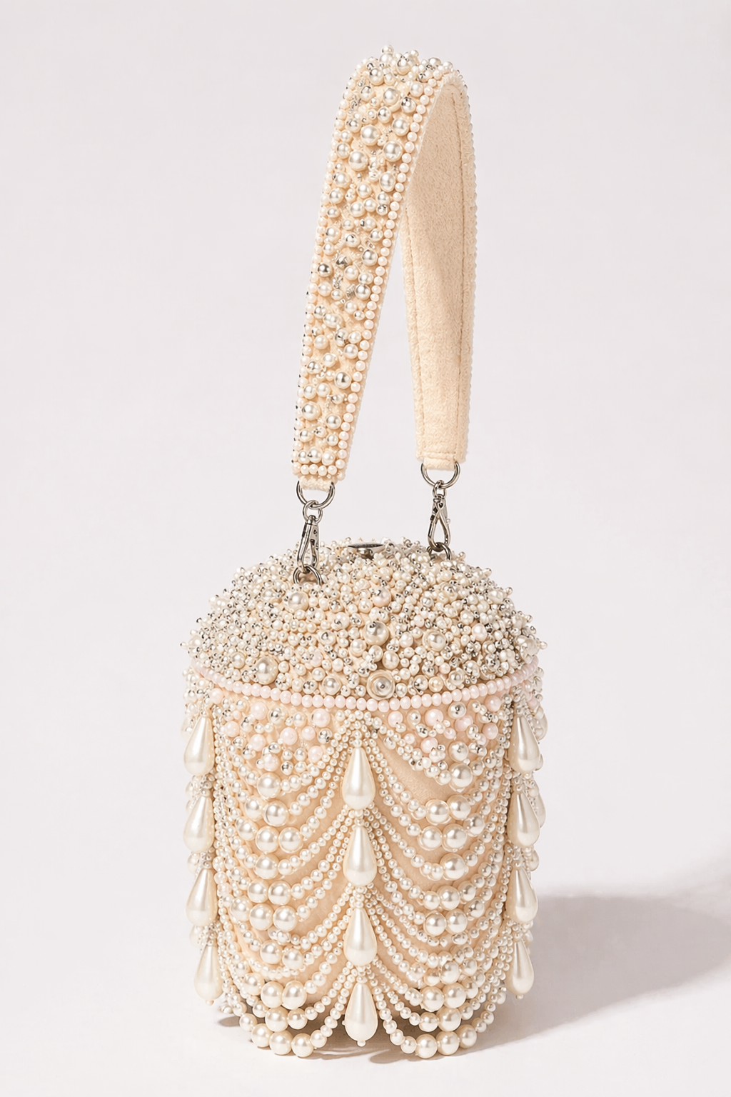 Pearl embellished bucket bag with cascading tassel detailing and handcrafted elegance
