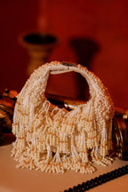 Pearl fringe evening bag inspired by luxury celebrations and glamorous occasion styling