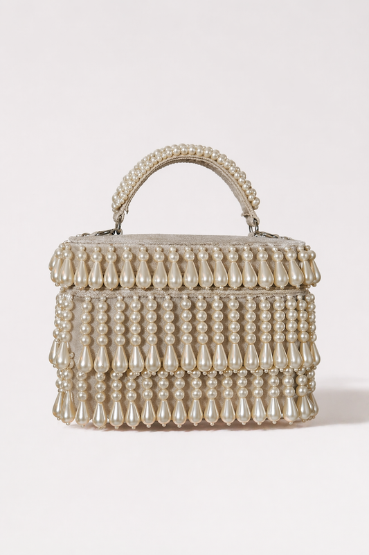 Pearl holiday party bag with layered pearl detailing and elegant handcrafted texture