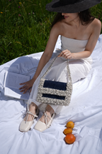 Pearl lunch party bag featuring handcrafted detailing and chic denim texture