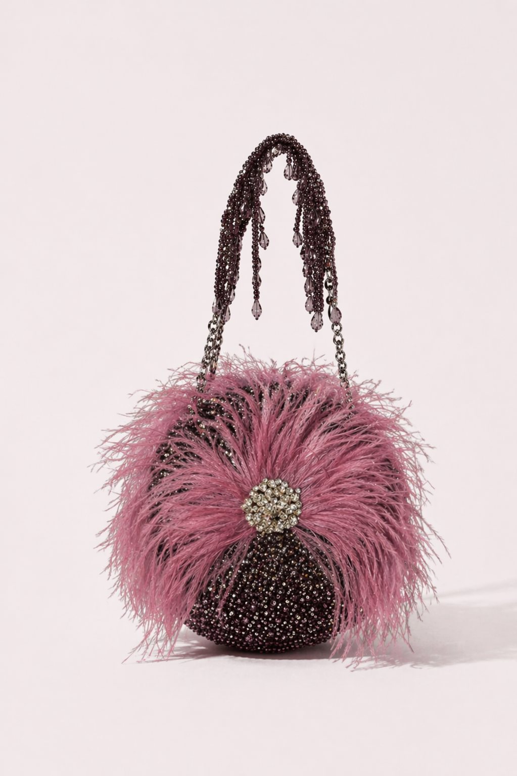 Feather party handbag with sparkling embellishments and dramatic festive texture