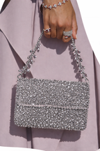 Festive party purse combining luxe embellishments