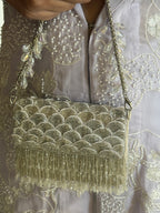 Silver chain handbag with intricate beadwork and statement festive shimmer