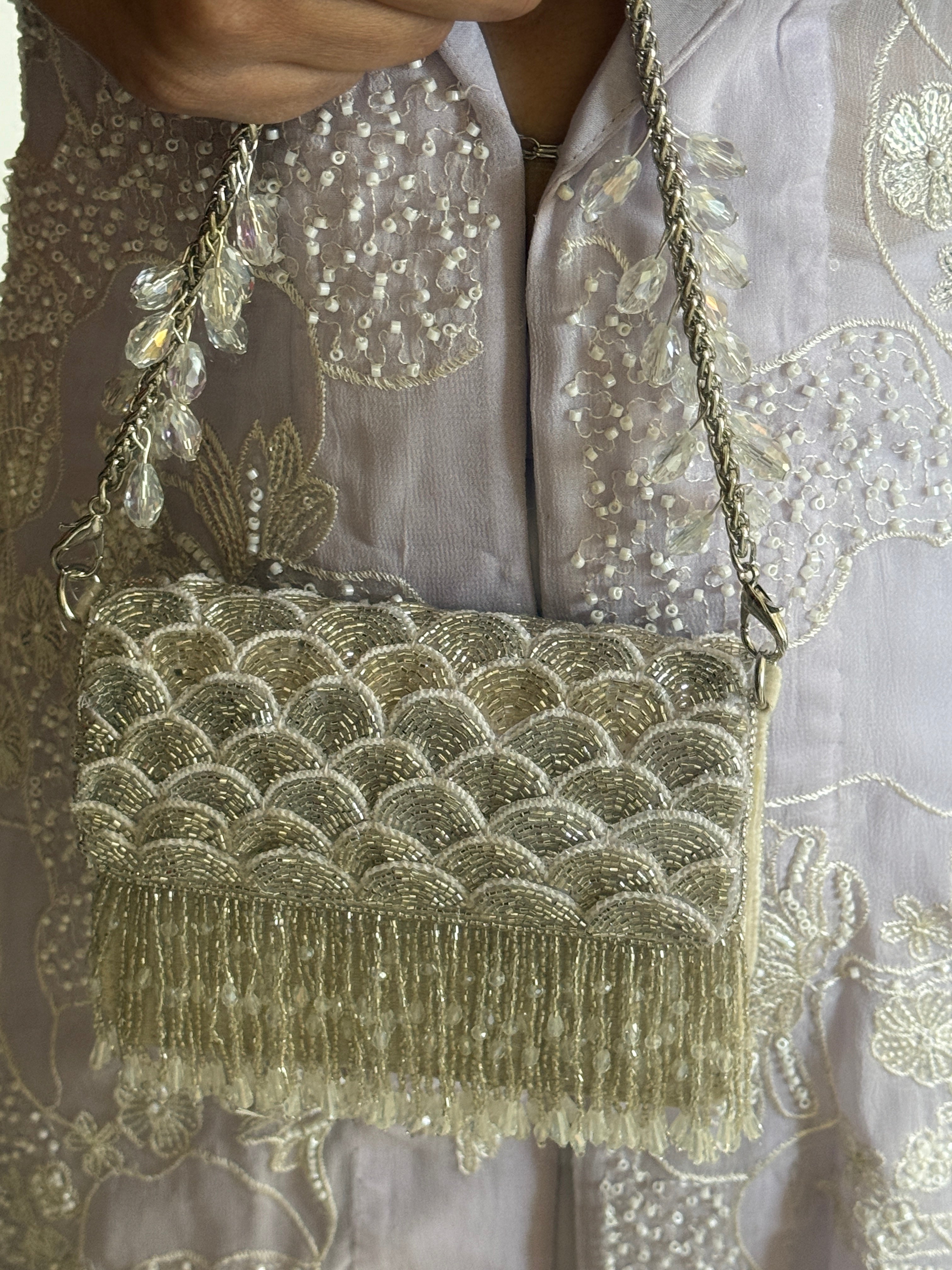 Silver chain handbag with intricate beadwork and statement festive shimmer