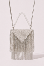 Silver fringe sling bag with shimmering crystal detailing and sleek metallic chains