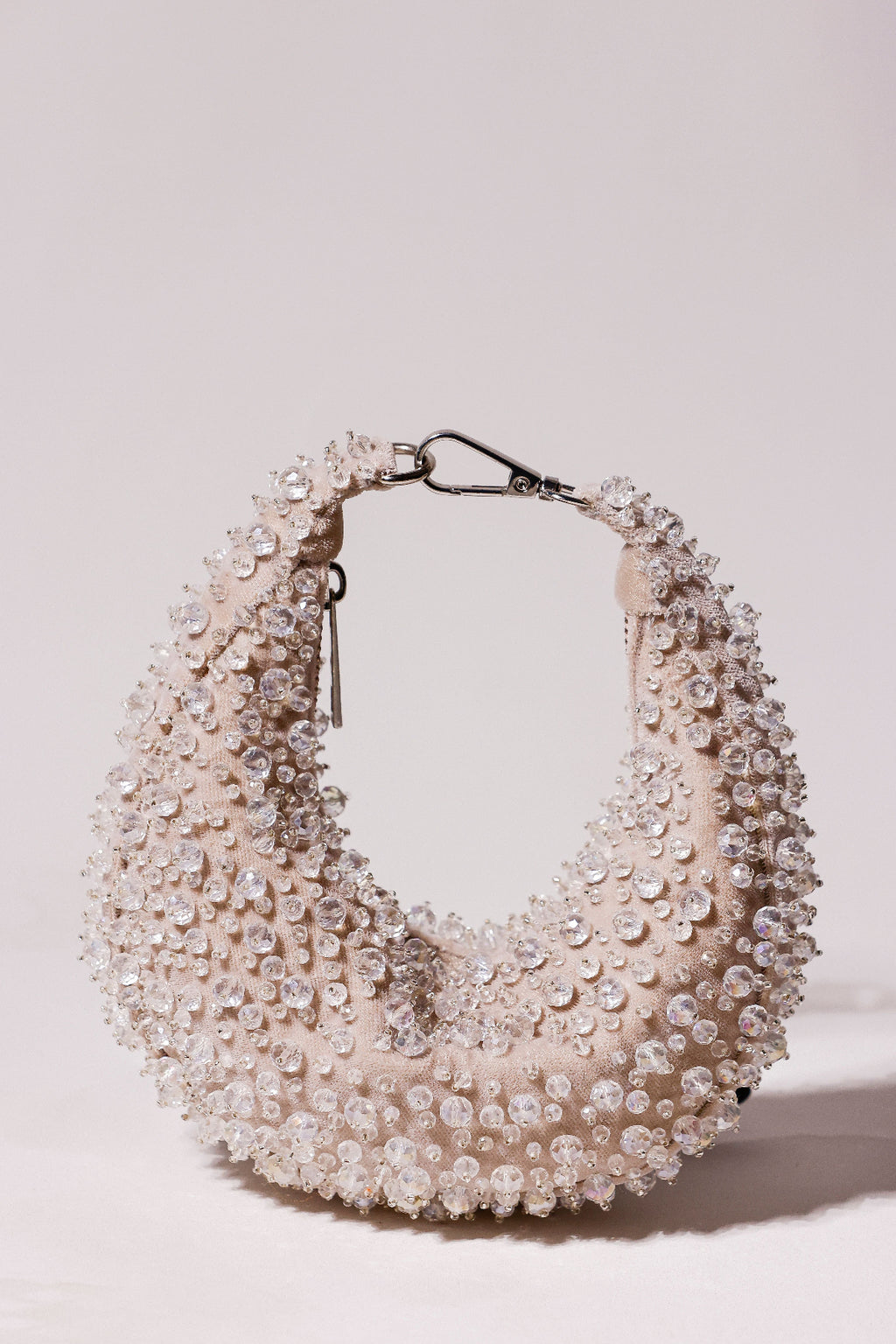 Silver pearl hobo bag with shimmering crystal embellishments and sculptural silhouette