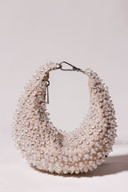 Silver pearl hobo bag with shimmering crystal embellishments and sculptural silhouette