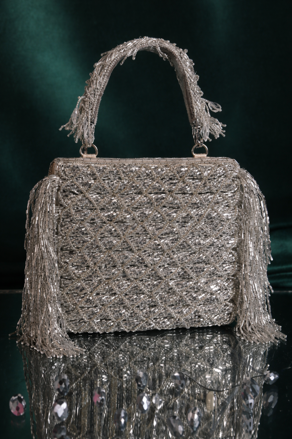 Silver sangeet occasion purse featuring handcrafted texture and statement fringe accents