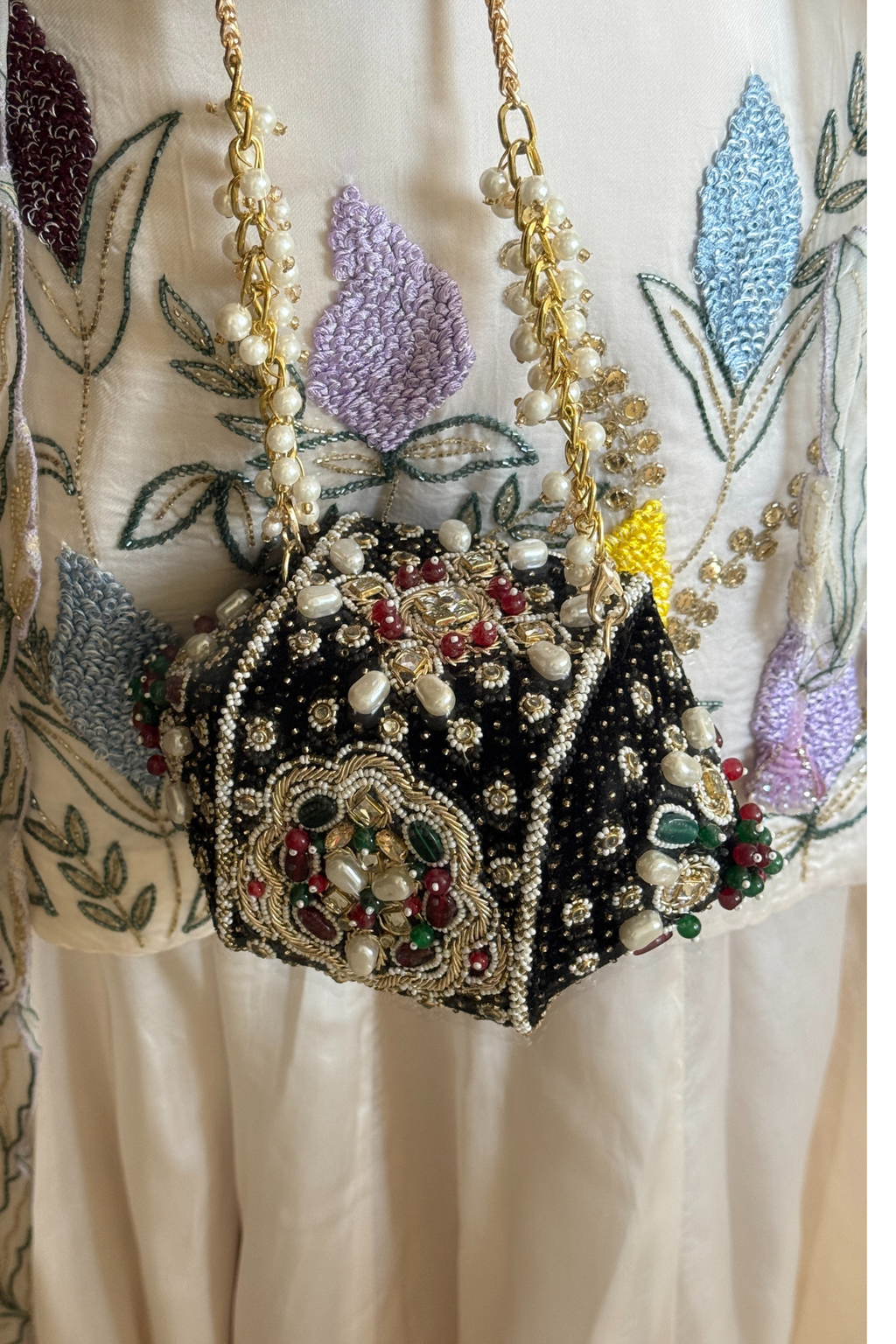 Traditional jewel-inspired occasion handbag with intricate beadwork and artistic detailing