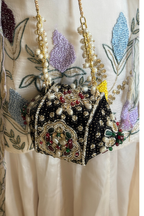 Traditional jewel-inspired occasion handbag with intricate beadwork and artistic detailing