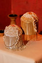 Wedding guest handbag with intricate fringe craftsmanship and reflective embellishments