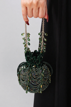Luxury wedding guest purse featuring handcrafted beadwork and statement tassel accents