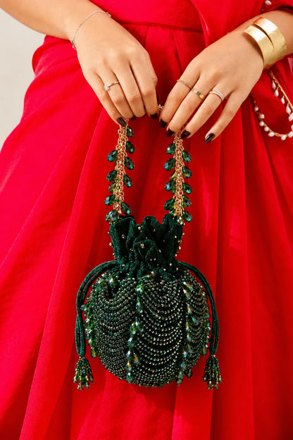 Luxury wedding guest purse featuring handcrafted beadwork and statement tassel accents