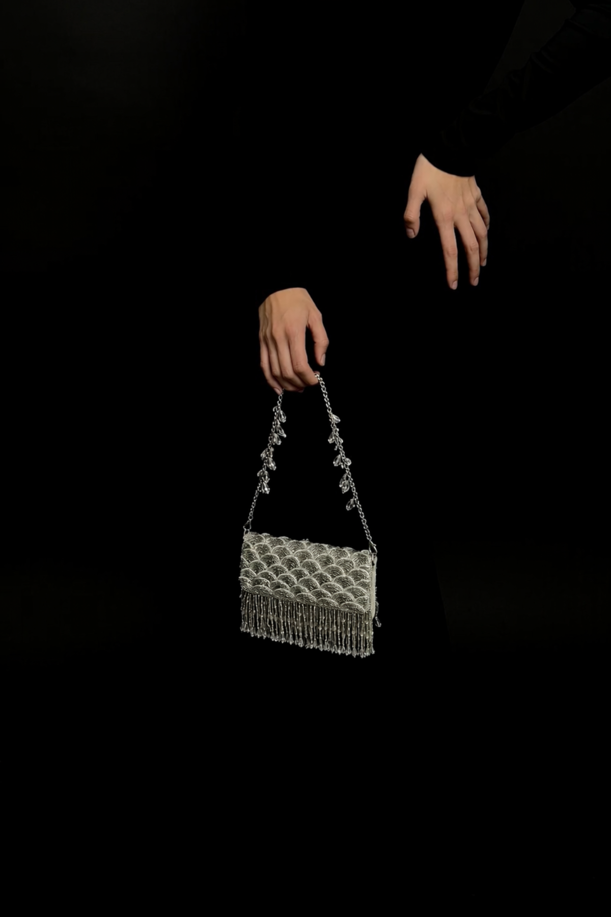Luxury wedding guest handbag featuring handcrafted sparkle and cascading fringe accents