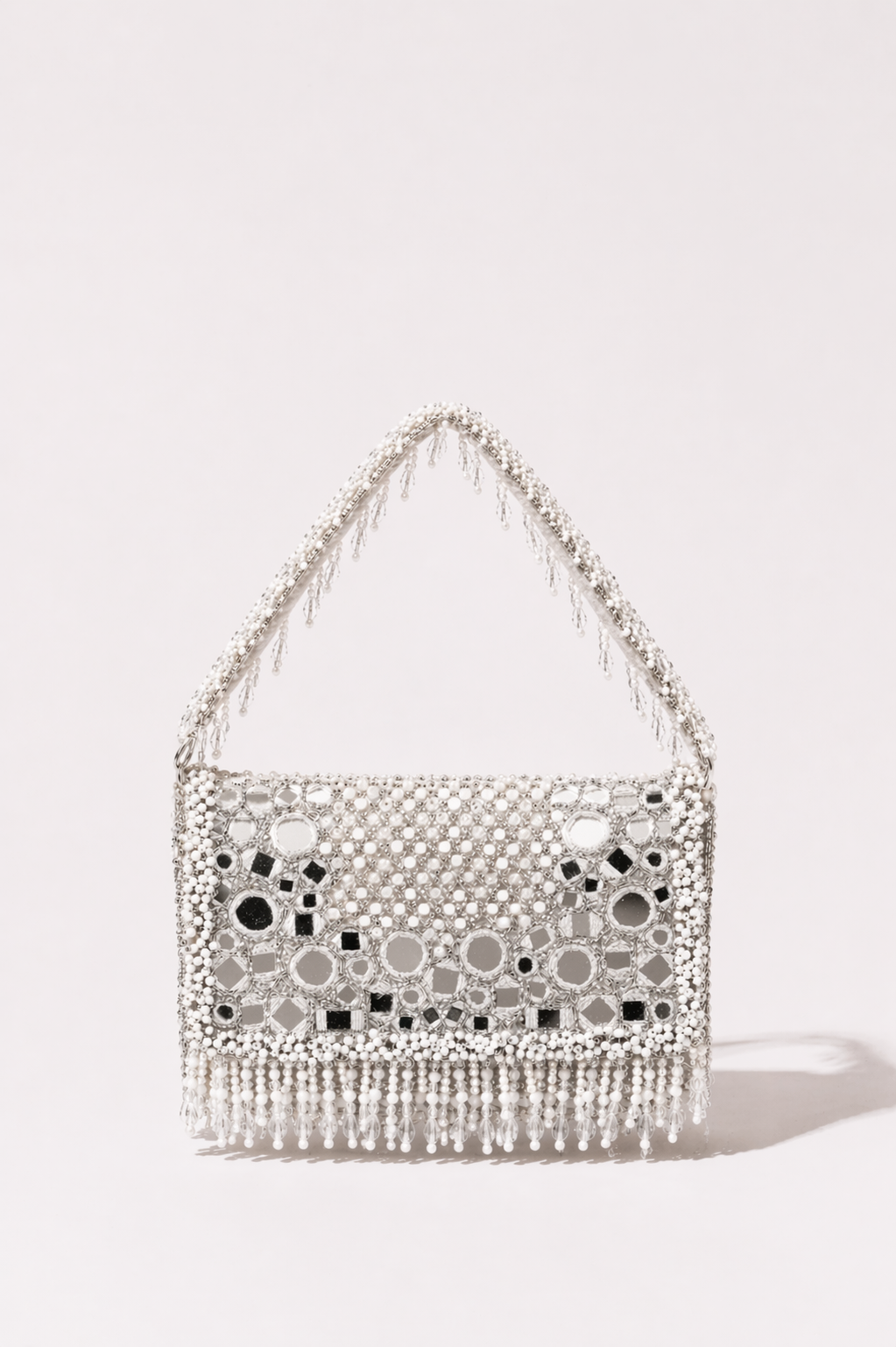 White beaded bag with pearl detailing and elegant fringe embellishments