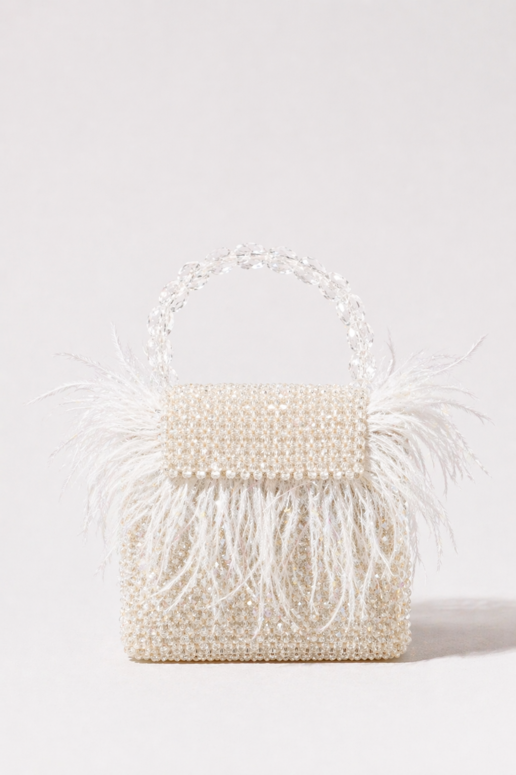 White feather sling handbag designed for bridal celebrations and cocktail evenings