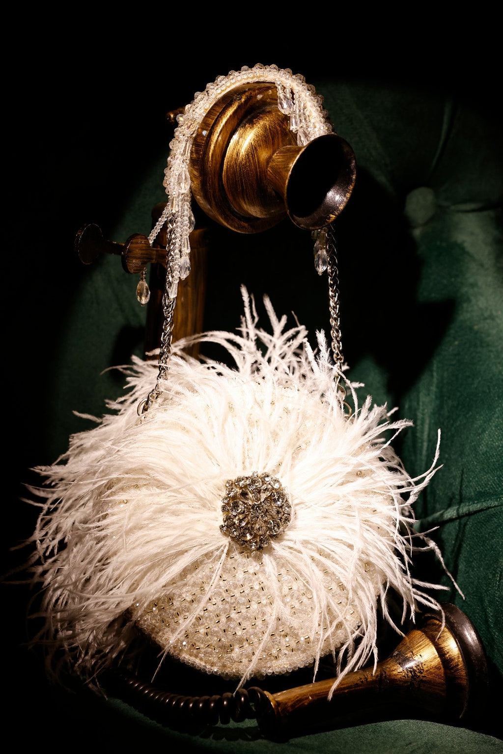 Feather embellished purse paired beautifully with bold occasion wear styling