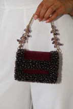 Wine evening statement bag featuring handcrafted crystal detailing and rich velvet texture