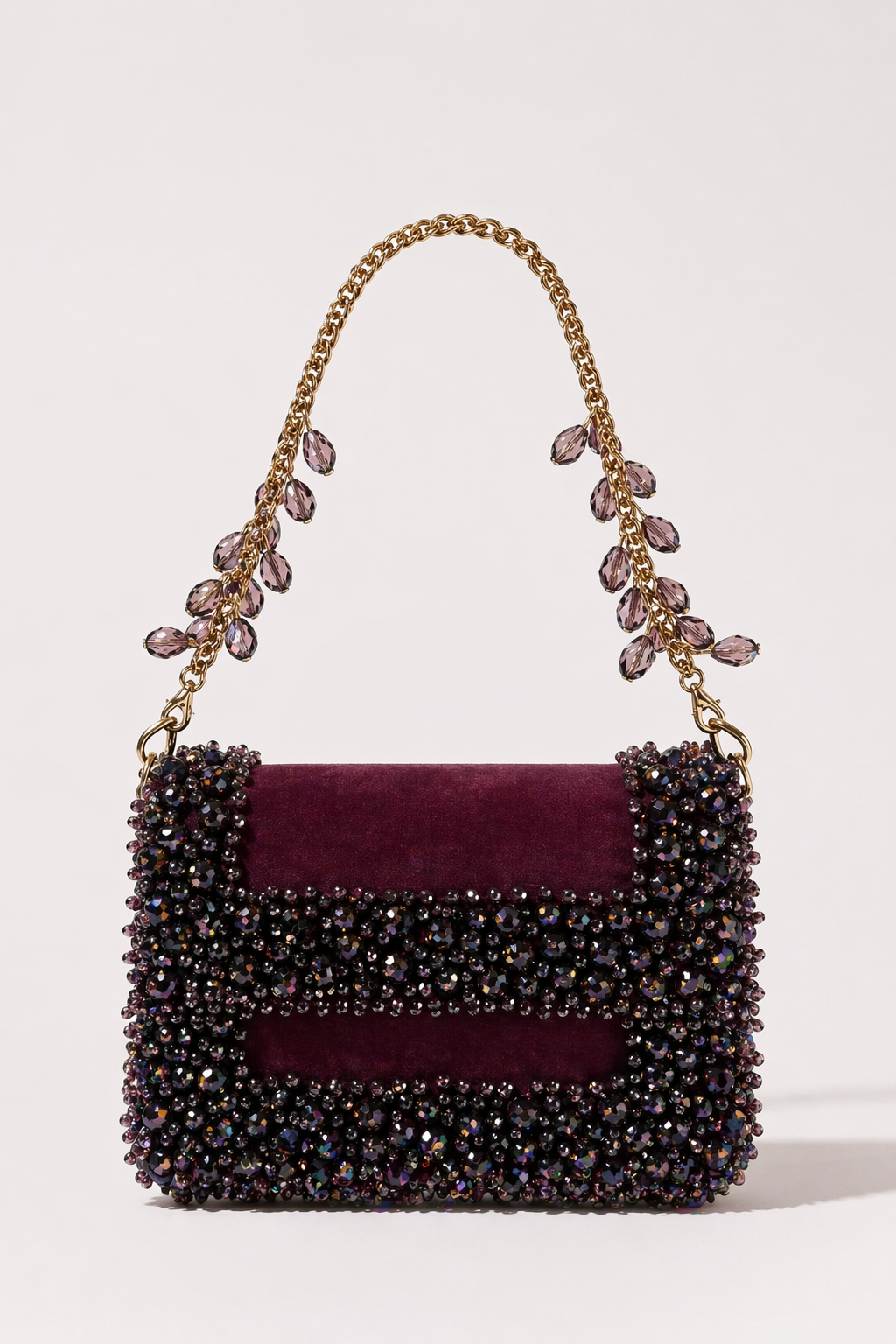 Wine pink designer handbag with sparkling embellishments and elegant chain detailing