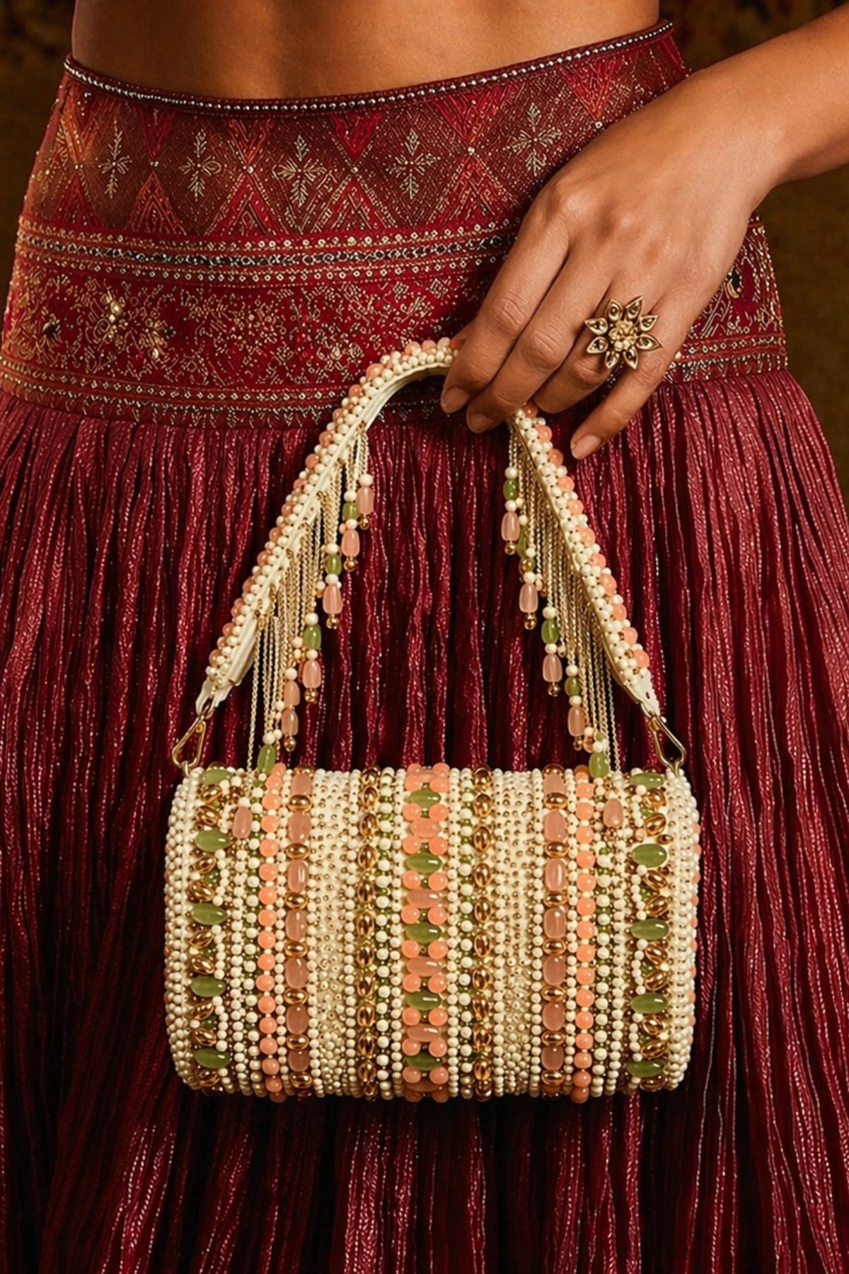 Ivory and peach shoulder bag for wedding functions
