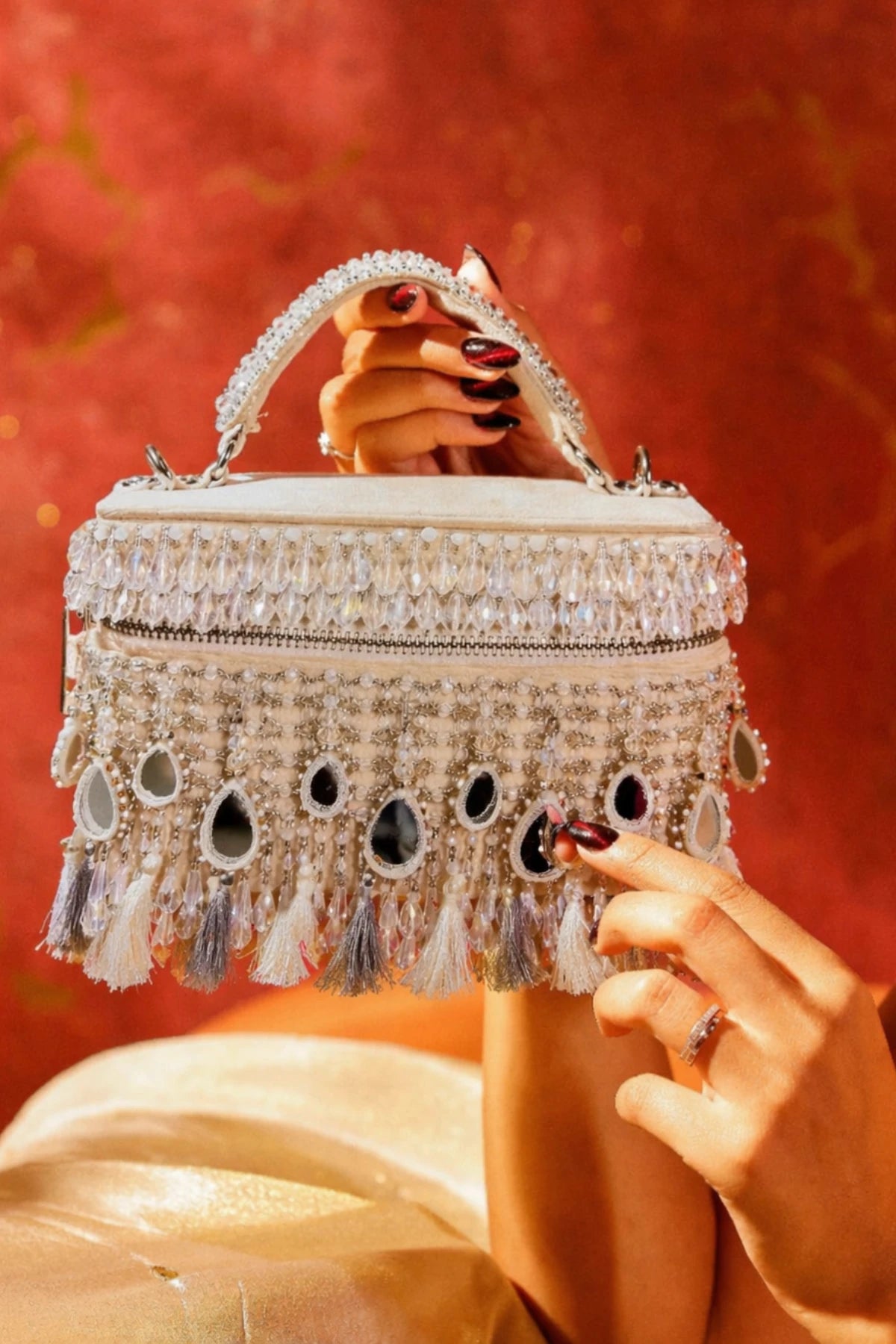 Ivory vanity bag styled with a haldi lehenga