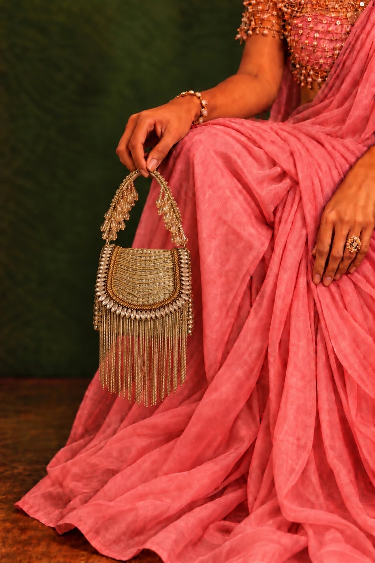 Leher Golden Mini Bag featuring sparkling golden crystals, cascading metallic fringes and a structured silhouette.