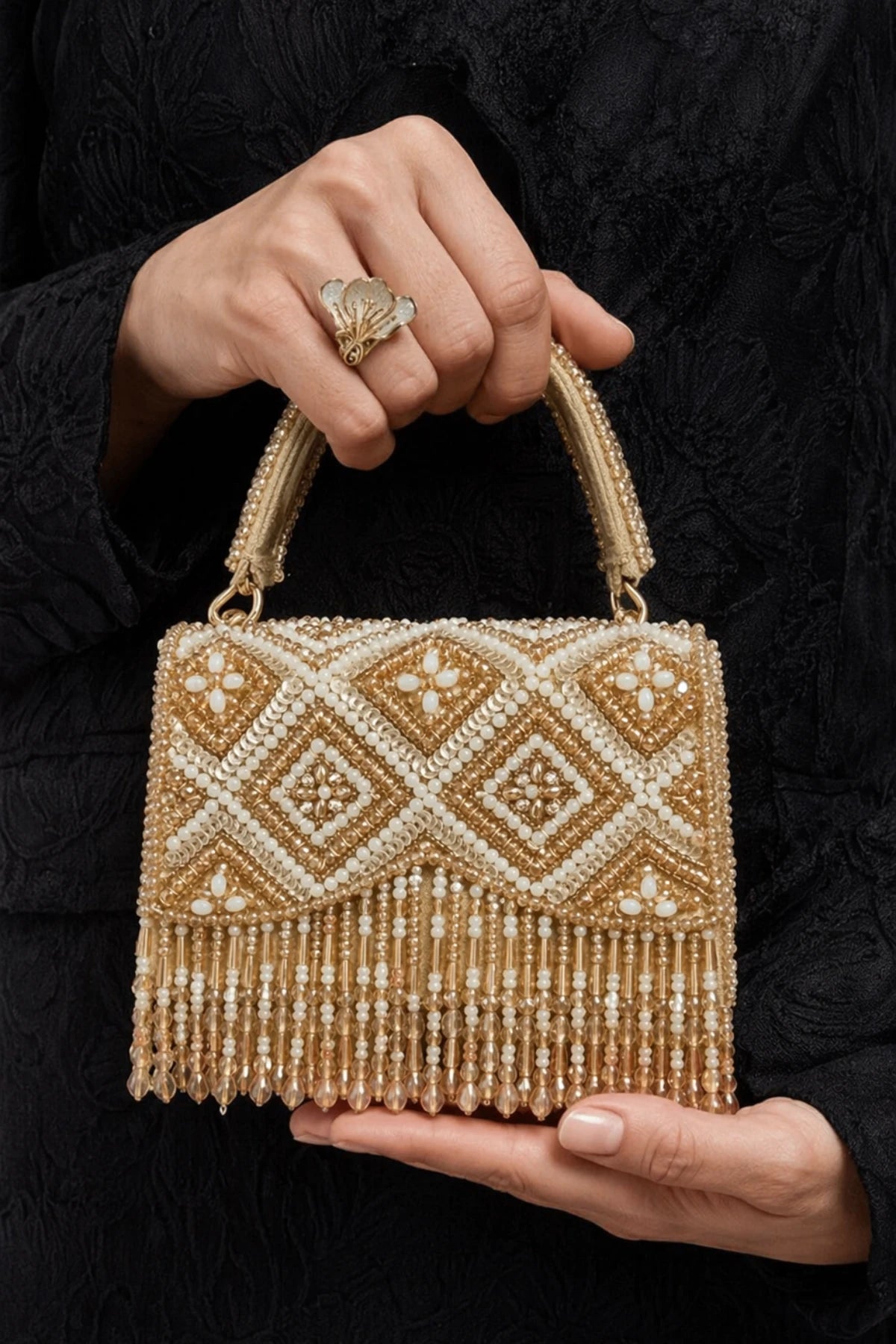 Luxury golden clutch bag with handcrafted embellishments
