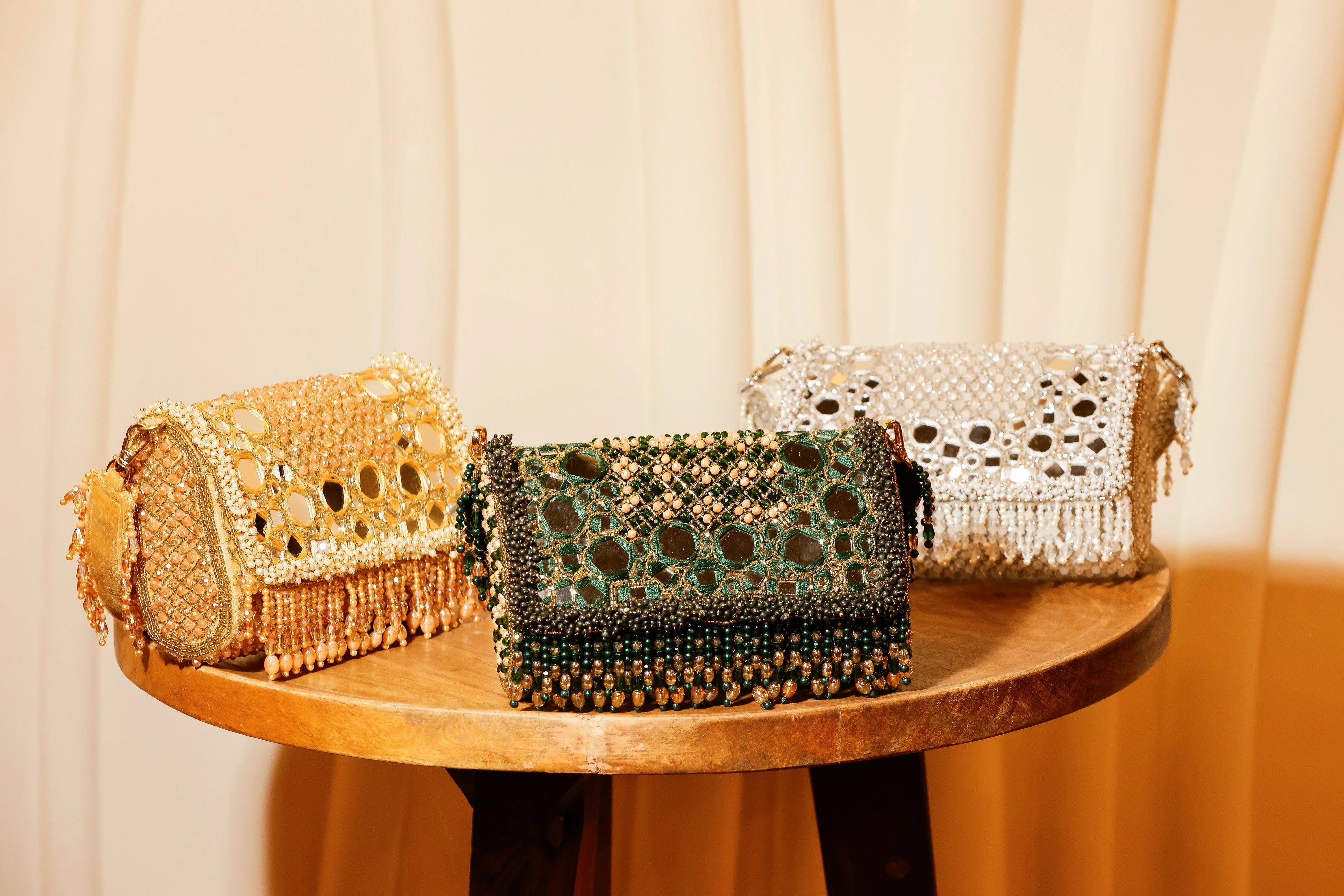 Luxury mirror work shoulder bag with handcrafted silver embellishments