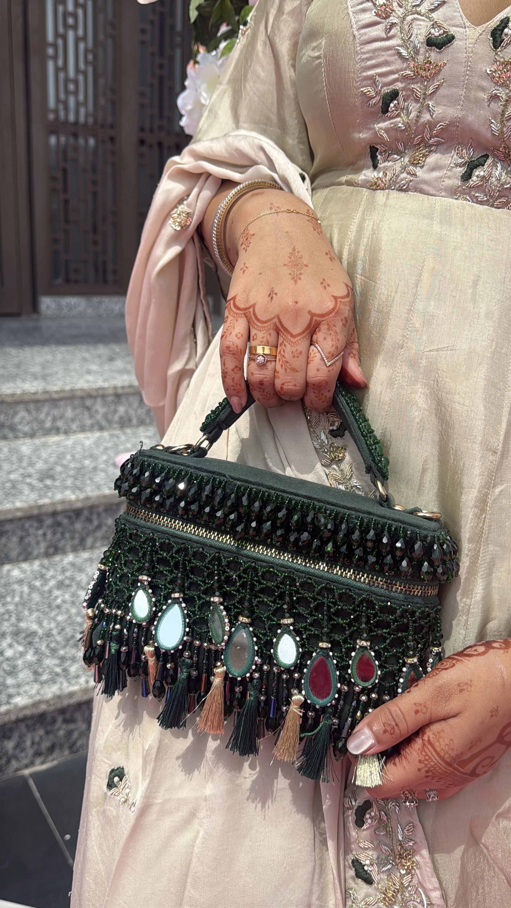 Green mehendi vanity bag for women with handcrafted detailing