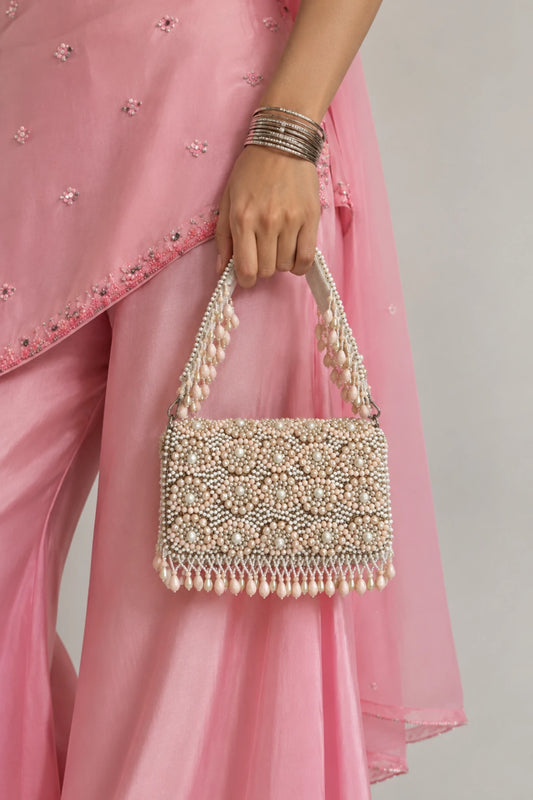 Mogra Pearl Bag featuring luminous white pearls, intricate floral-inspired beadwork and a structured silhouette for mehendi celebrations.