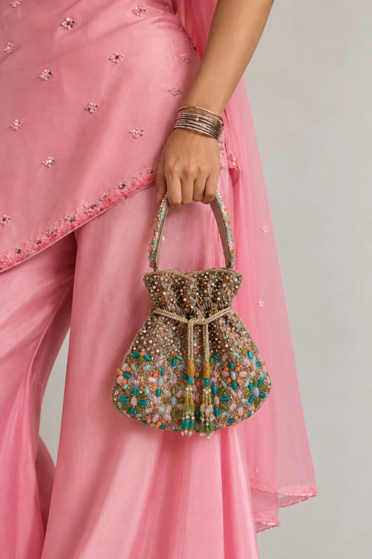 Mosaic Drawstring Potli featuring vibrant multicoloured beadwork, sparkling stones and a voluminous silhouette for mehendi celebrations.