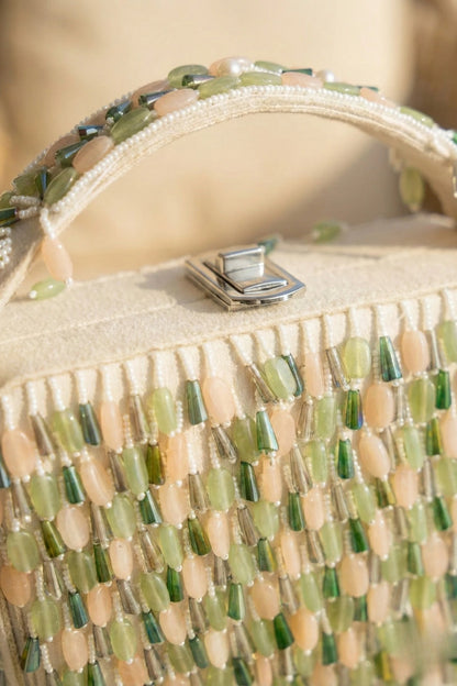 Multi colour clutch bag styled with a summer dress