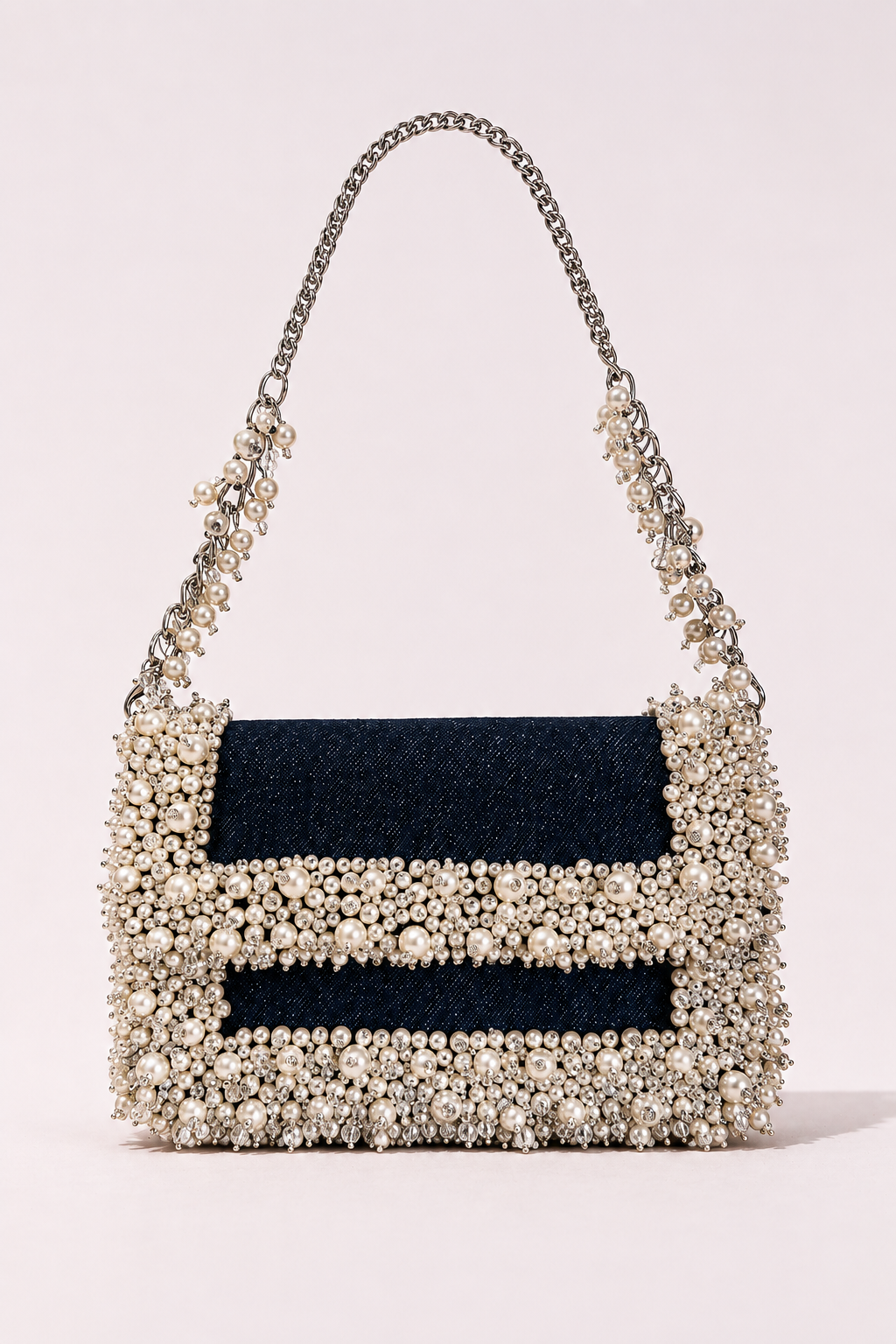Denim pearl designer handbag with elegant embellishments and sophisticated chain detailing