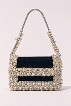 Denim pearl designer handbag with elegant embellishments and sophisticated chain detailing