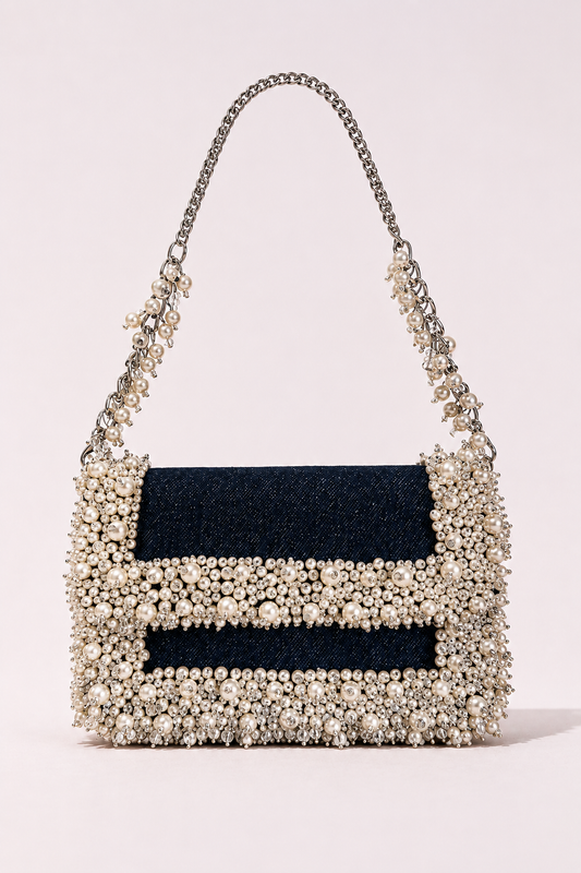 Denim pearl designer handbag with elegant embellishments and sophisticated chain detailing