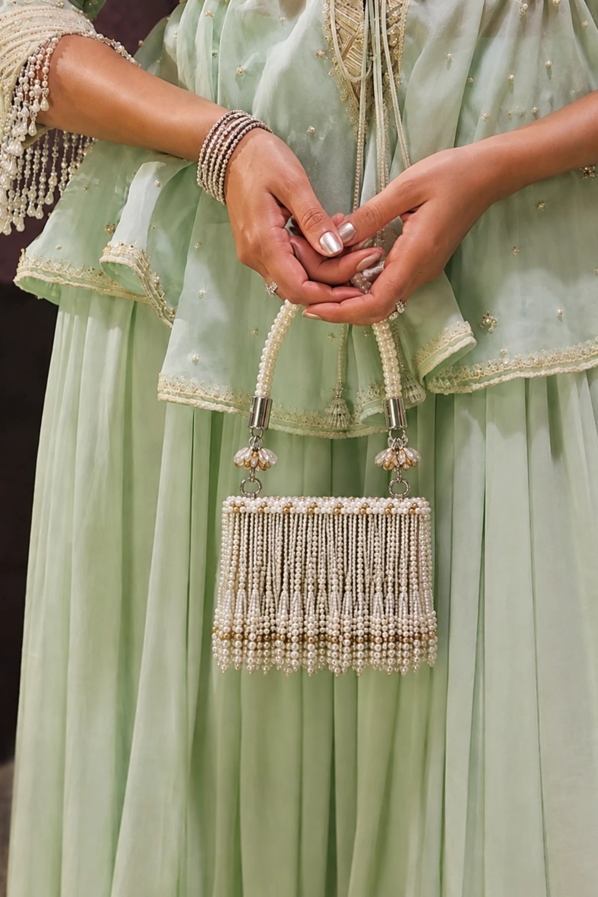 Pearl mini bag styled with a festive Haldi lehenga
