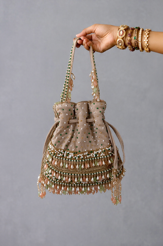 Pearl potli bag with intricate bead embroidery and gemstone detailing