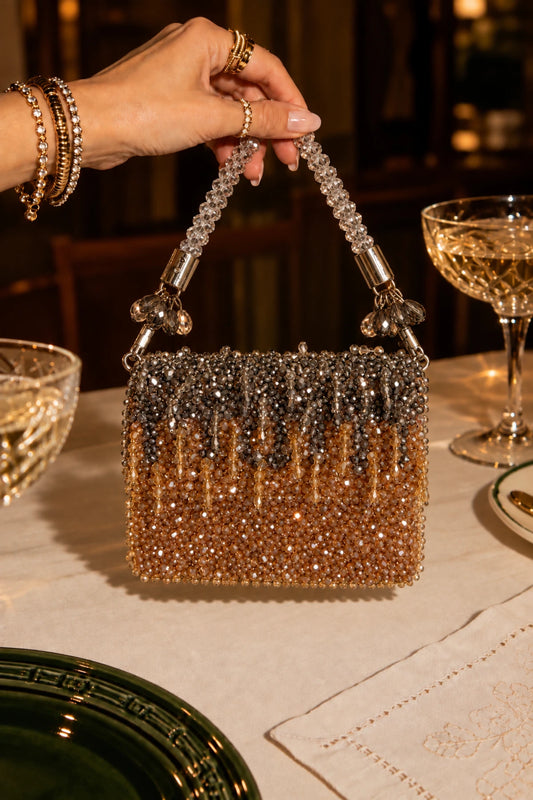 Prosecco Mini Clutch in gold and silver with handcrafted bead embellishments, perfect for parties and celebrations.