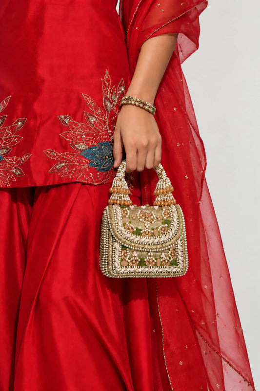 Regal Golden Mini Bag featuring intricate golden beadwork, pearl embellishments and green accents, perfect for mehendi celebrations.
