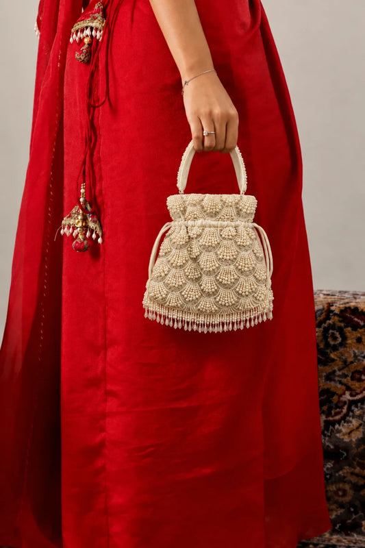 Shell-inspired pearl potli bag with intricate layered beadwork