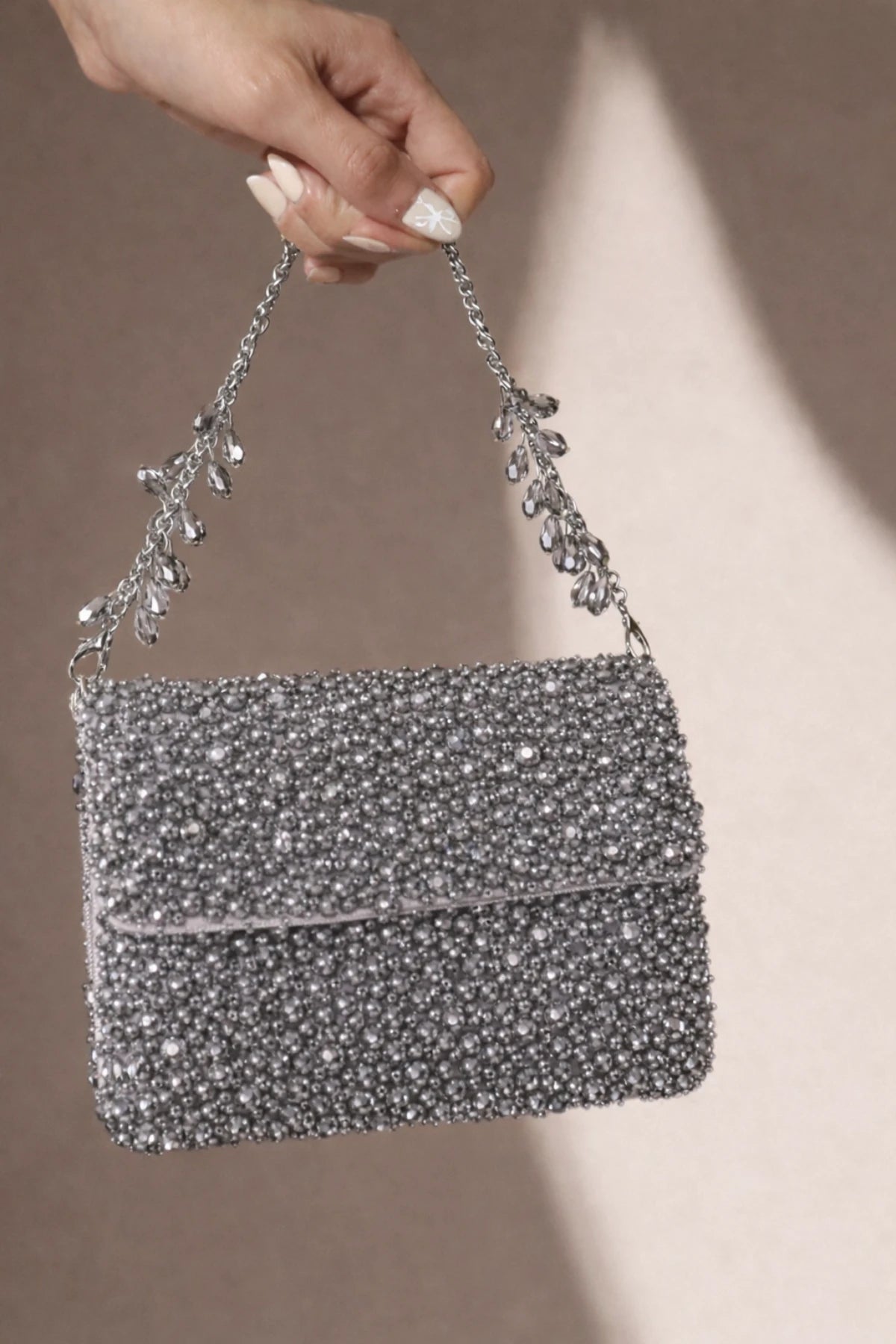 Silver shoulder bag for modern party wear and celebrations