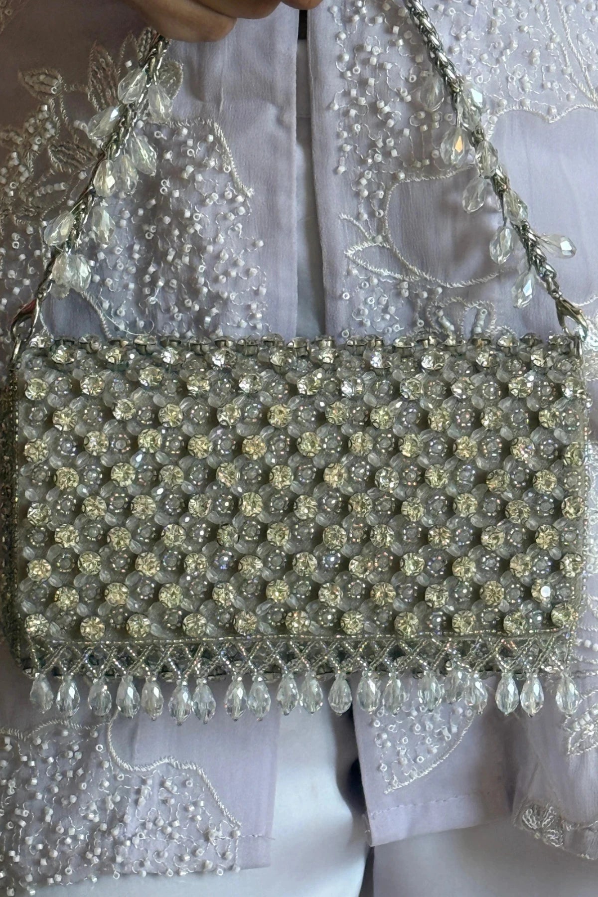 Silver shoulder bag styled with an Anarkali for festive celebrations